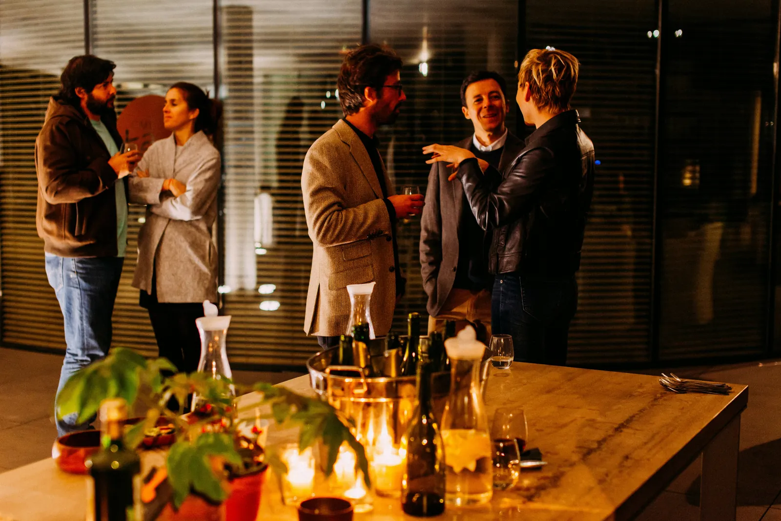 Delegates talking over drinks at an evening reception